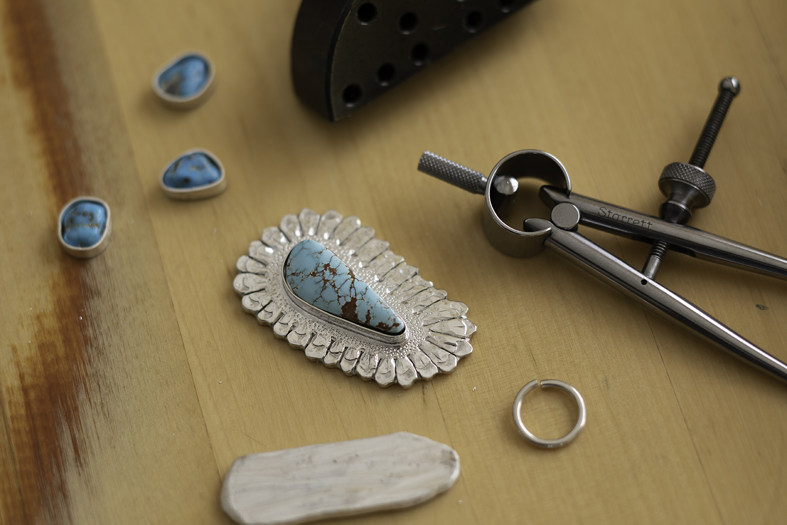 Pendant 38 on table.