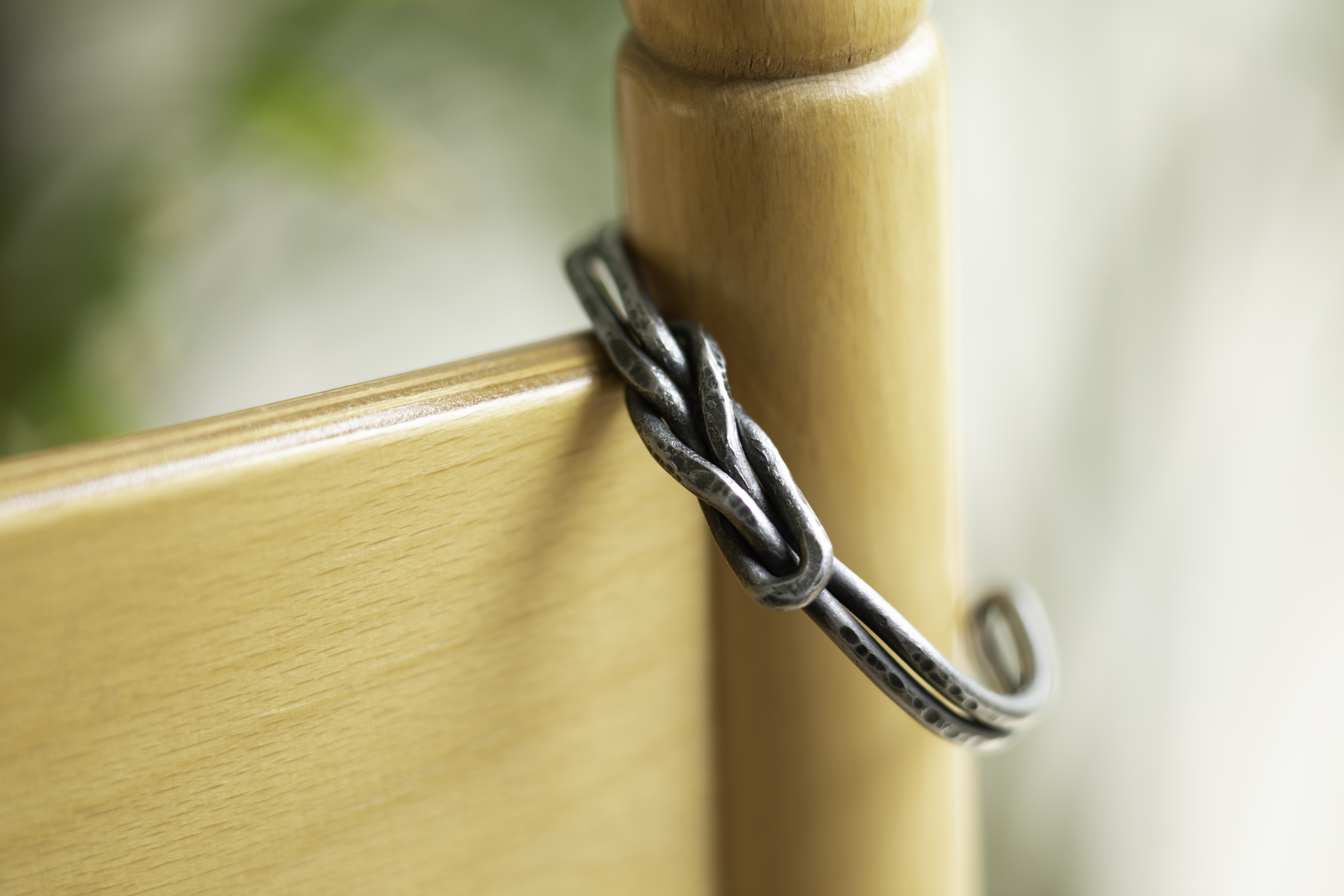 Steel knot cuff on chair.